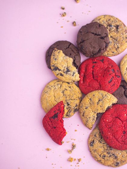 A beautiful mess of my assorted cookies. This overhead shot shows the vibrant red velvet and rich double chocolate chip cookies ready to be enjoyed.