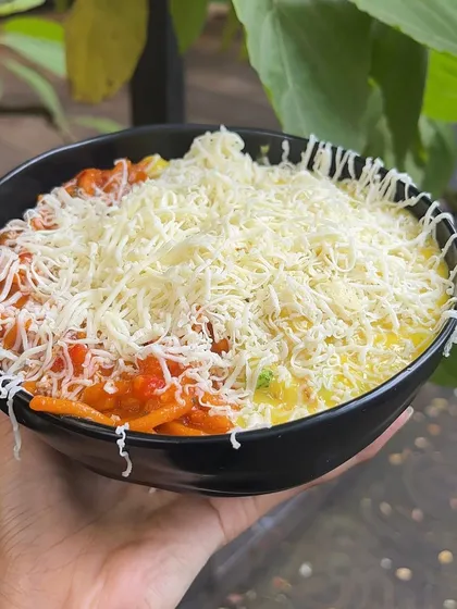 A close-up of my Pasta & Pasta, showing the generous amount of cheese that covers the dish. It's a cheese lover's paradise.