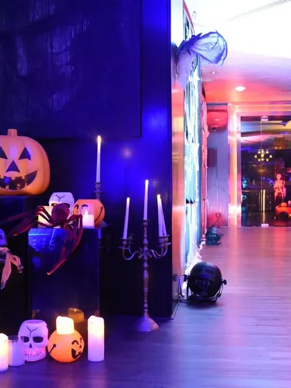 Another corner of the Halloween event, with skulls, candles, and spooky lighting. Every detail was curated to contribute to the immersive and fun horror theme.