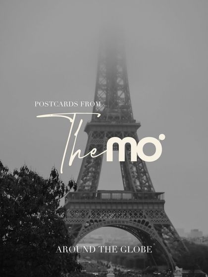 A "Postcards from The Mo" graphic featuring a moody, black and white image of the Eiffel Tower shrouded in fog. It sets a cinematic and artistic tone for my global destination work.