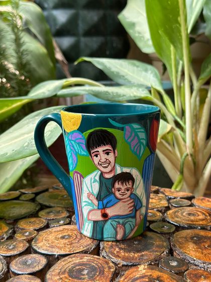 A touching Father's Day gift: a mug with a portrait of a father holding his young child.