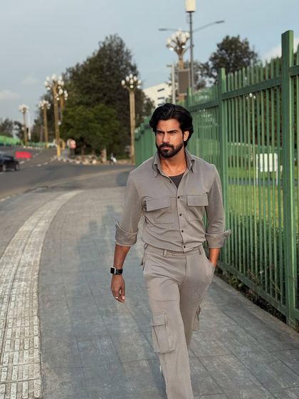 A confident walking shot that highlights the comfortable fit and sleek design of our travel wear.