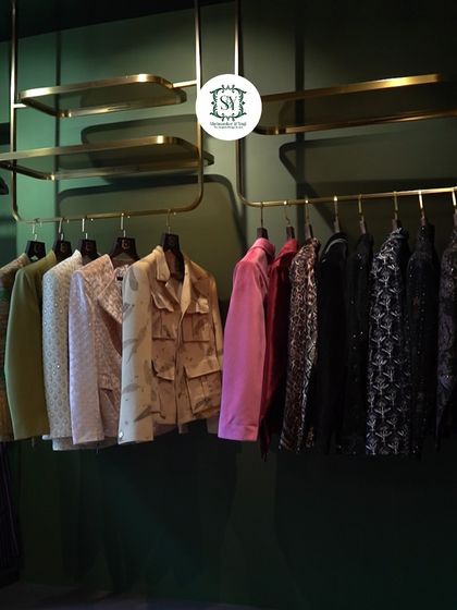 An overview of our jacket and shacket collection on display in our studio. You can see a range of styles, from formal embroidered pieces to casual, everyday wear.