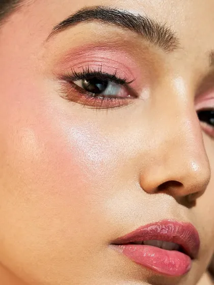 A stunning example of a monochromatic pink look. The skin is glowing, and the cheeks have a beautiful, healthy flush of color.