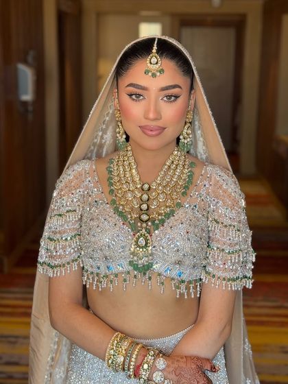 My angel bride, Tanvi. Here she is looking absolutely radiant for her day wedding in a stunning Falguni Shane Peacock lehenga with a clean, sharp liner and glowing skin.