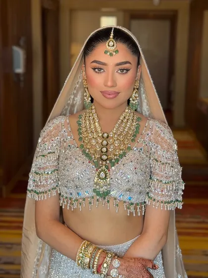 My angel bride, Tanvi. Here she is looking absolutely radiant for her day wedding in a stunning Falguni Shane Peacock lehenga with a clean, sharp liner and glowing skin.