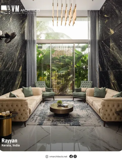 This double-height living room in the Rayyan project showcases how I blend luxury with comfort. The dramatic black marble walls and floor-to-ceiling windows create a space that is both grand and intimately connected to the lush greenery outside.