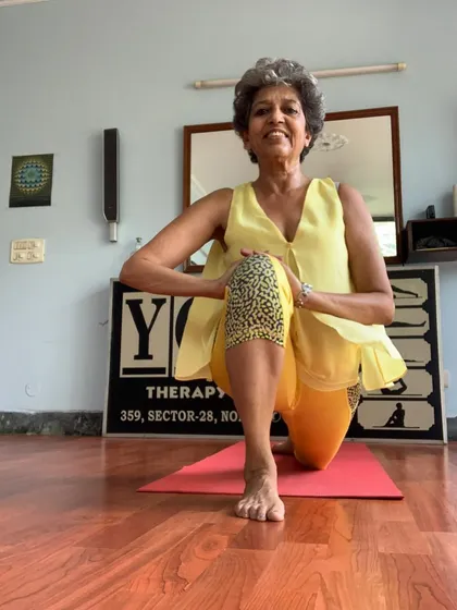 A gentle low lunge, showing that yoga is a journey of self-love and gentle movement.