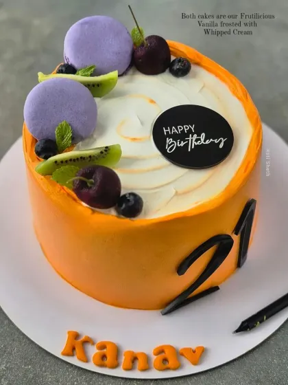 A vibrant orange cake for a 21st birthday. This is my Frutilicious Vanilla flavour, topped with fresh cherries, kiwi, blueberries, and macarons.