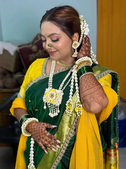 A closer look at the intricate floral jewelry and radiant makeup for a traditional Haldi ceremony.