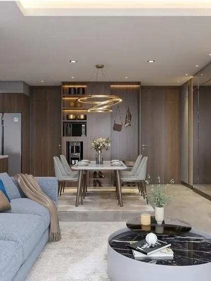 This angle shows a different configuration with a blue sofa and a dining area integrated into the main living space, showcasing our versatility in design.