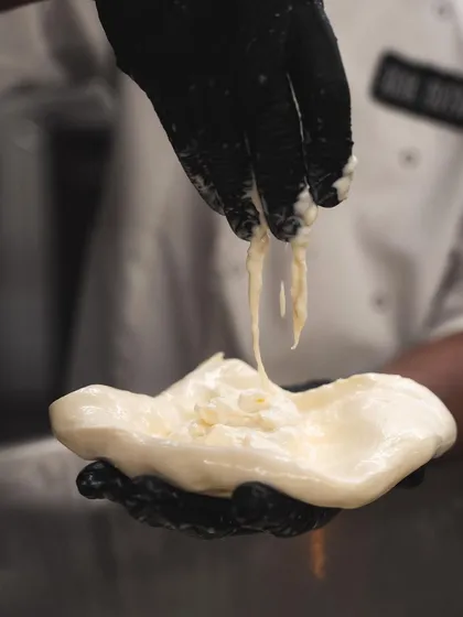 Another shot of our stracciatella, showing its rich and stringy texture that makes our burrata so irresistible.