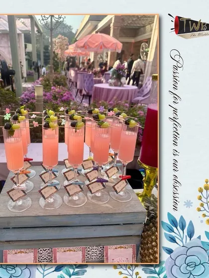 Our Lychee Rose Delight mocktails, beautifully garnished and ready for guests to enjoy at an outdoor wedding function.