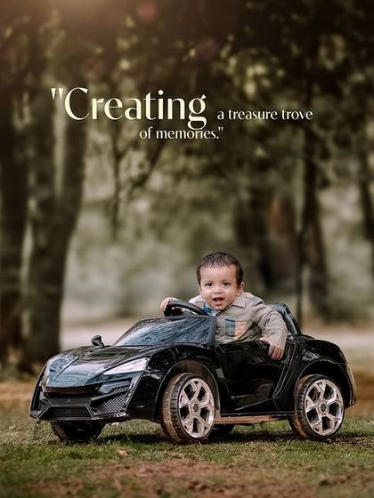 Creating a treasure trove of memories. A happy baby boy takes a ride through a wooded path in his toy car.