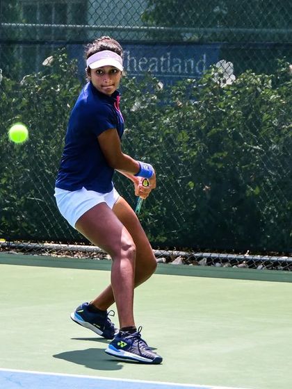 Sahaja Yamalapalli in action at the ITF W100 Koser Jewelers Tennis Challenge, hitting a powerful backhand.