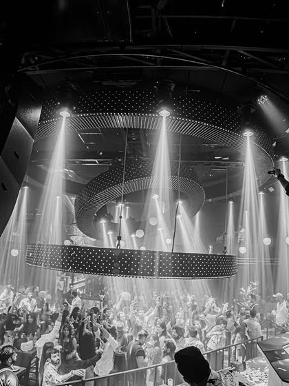 A black and white shot capturing the grand scale of Prism Mohali's interior.