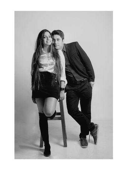 Another pose from the same studio session, this black and white photo has a timeless, elegant feel, focusing on their confident connection.