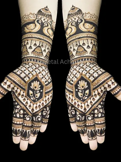 A striking symmetrical design against a black background to highlight the details. This pattern features swans, lotuses, and jhumkis, creating a perfectly balanced and royal look.