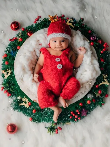 An overhead shot of the complete Christmas wreath setup. It's a unique and festive way to capture your baby's first Christmas.