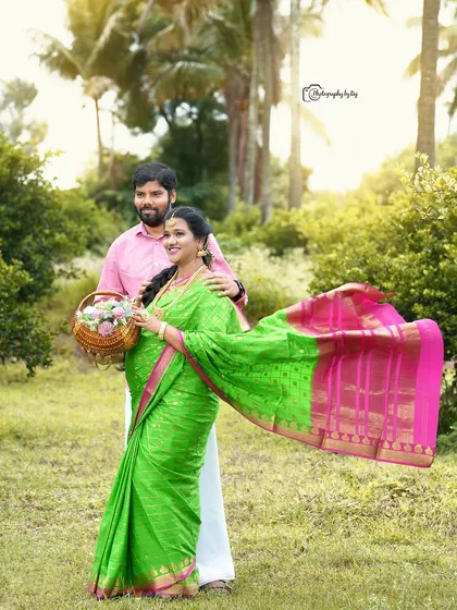 A graceful portrait of a couple in our garden. The flowing pallu of the bright green and pink saree adds a sense of movement and elegance.