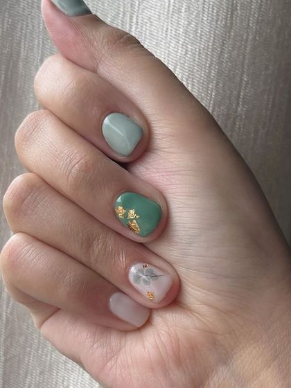 Another view of the chic teal and marble manicure.