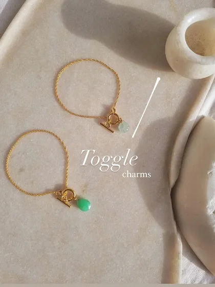 My toggle charm bracelets are designed for simple, everyday wear. This photo shows the 'nárūra' bracelet with an aquamarine charm for calm and the 'aṃahú' bracelet with a chrysoprase charm to help heal a broken heart.