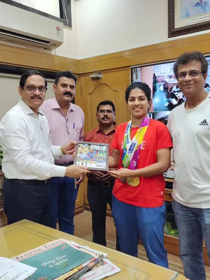 It's important to have support from all sides. Here, the principal of Swastika's college, CKT College, is honoring her for winning two Gold and one Bronze medal at the 37th National Games in Goa.