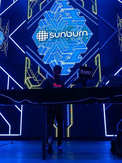 A silhouette against the incredible geometric visuals of the Sunburn stage.