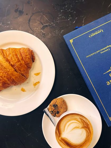 A perfect combination: coffee, a croissant, and a book on Forest and Wild Life Laws. My work is my passion, and it's always on my mind.