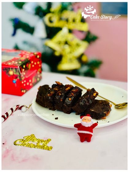 A slice of my homemade Christmas plum cake. It's rich, moist, and packed with dry fruits, perfect to enjoy with a warm drink on a chilly evening.
