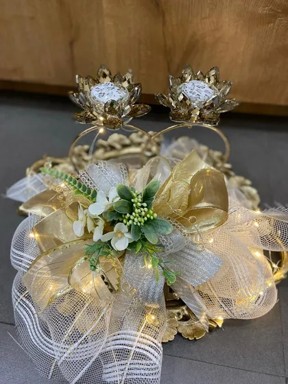 We designed this festive hamper with fairy lights woven into the packaging, creating a gift that literally glows. It features our lotus-shaped diya holders, making it a perfect choice for Diwali.