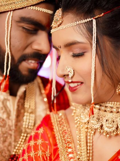 A close-up, intimate portrait of the bride and groom, with a focus on the bride's happy expression.