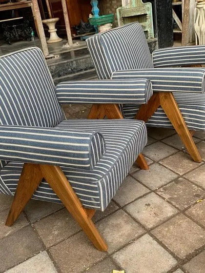 Side view of the custom-upholstered V-leg chairs.