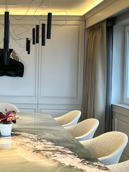 A detail of the dining space, focusing on the interplay between the chairs, table, and my artwork.