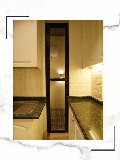 A look at the utility and layout of our kitchen design, featuring a granite countertop, double sink, and easy access to the adjoining utility area.