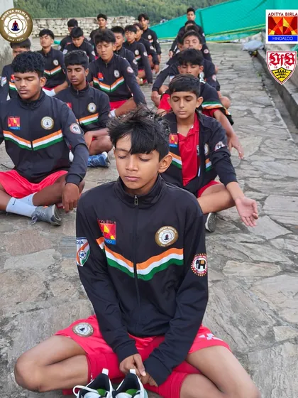 Football is a game of the mind as much as the body. Here, our U16 team practices breathing and meditation at a monastery in Bhutan. We focus on holistic development, ensuring our players are calm and centered under pressure.