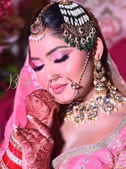 A closed-eye shot to showcase the glittery pink eyeshadow work. This is a popular choice for brides who want their eyes to sparkle and stand out during their wedding ceremony.