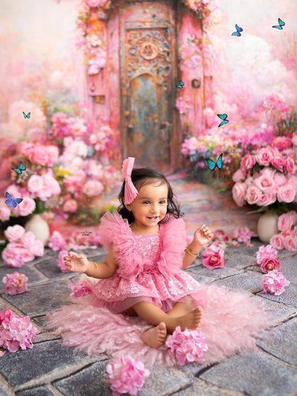 Sitting among a sea of pink flowers, this little girl is the star of her own fairytale.