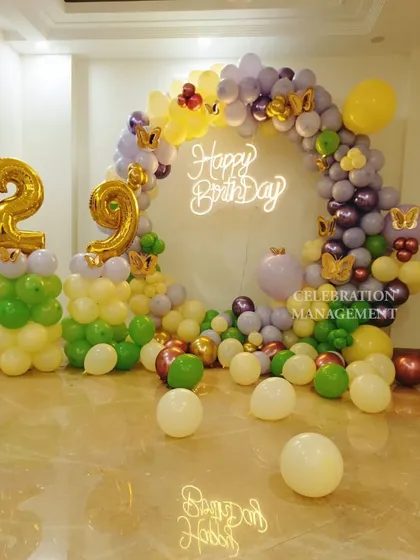 The full setup for the 29th birthday, including the large gold foil numbers that stand out against the colorful balloons.