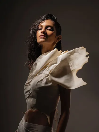 An editorial shoot for the brand Kachiwala. This look is all about wet, glowing skin and a raw, sculptural feel that complements the unique fashion.