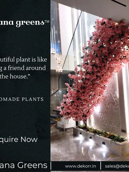 A beautiful plant is like having a friend around the house. This large, handmade pink flowering tree brings so much life and character to this high-ceilinged space.