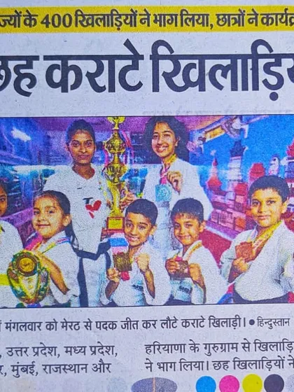 A colorful newspaper clipping showing our victorious students after their return from the Meerut championship.