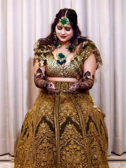 The bride admiring her freshly applied Mehndi. I capture these quiet, happy moments that are filled with anticipation for the wedding day.