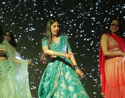 A fun moment from a bridesmaids' performance. We make sure our choreography is full of energy and personality.