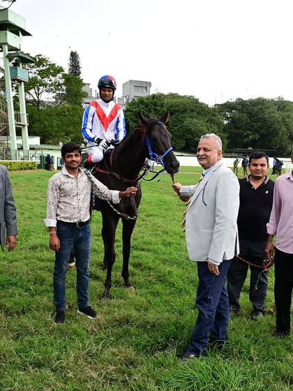 Time and Tide, winner of The Bangalore City Sprint Championship Gold Cup, with jockey A. Sandesh and the winning team.