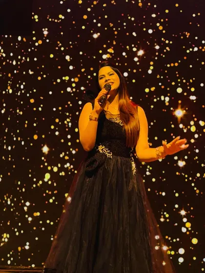 On stage is where I feel most at home. This shot from a sangeet night captures me in my element, ready to get the party started. A professional emcee ensures your event flows smoothly while keeping the entertainment going.