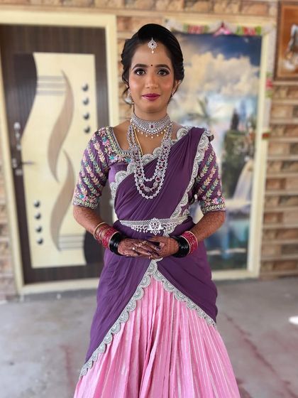 The full view of Nayan's unique reception outfit. The draping is modern and stylish, and the makeup completes the elegant look.