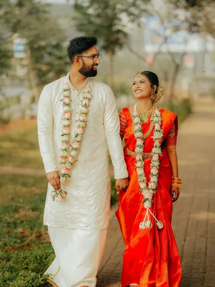 A joyful, candid walk shared by a South Indian couple right after their ceremony. I focus on capturing these unposed moments of pure happiness that truly reflect the vibe of your day.
