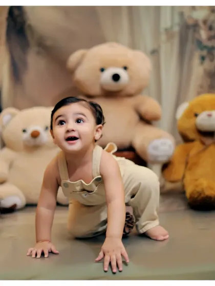A playful crawling pose from our teddy bear studio session. We capture all the important milestones, including sitting up and crawling.