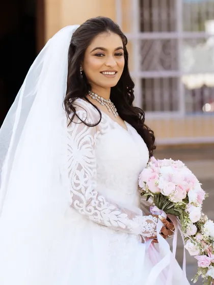The bride's happy smile says it all in this lovely portrait.